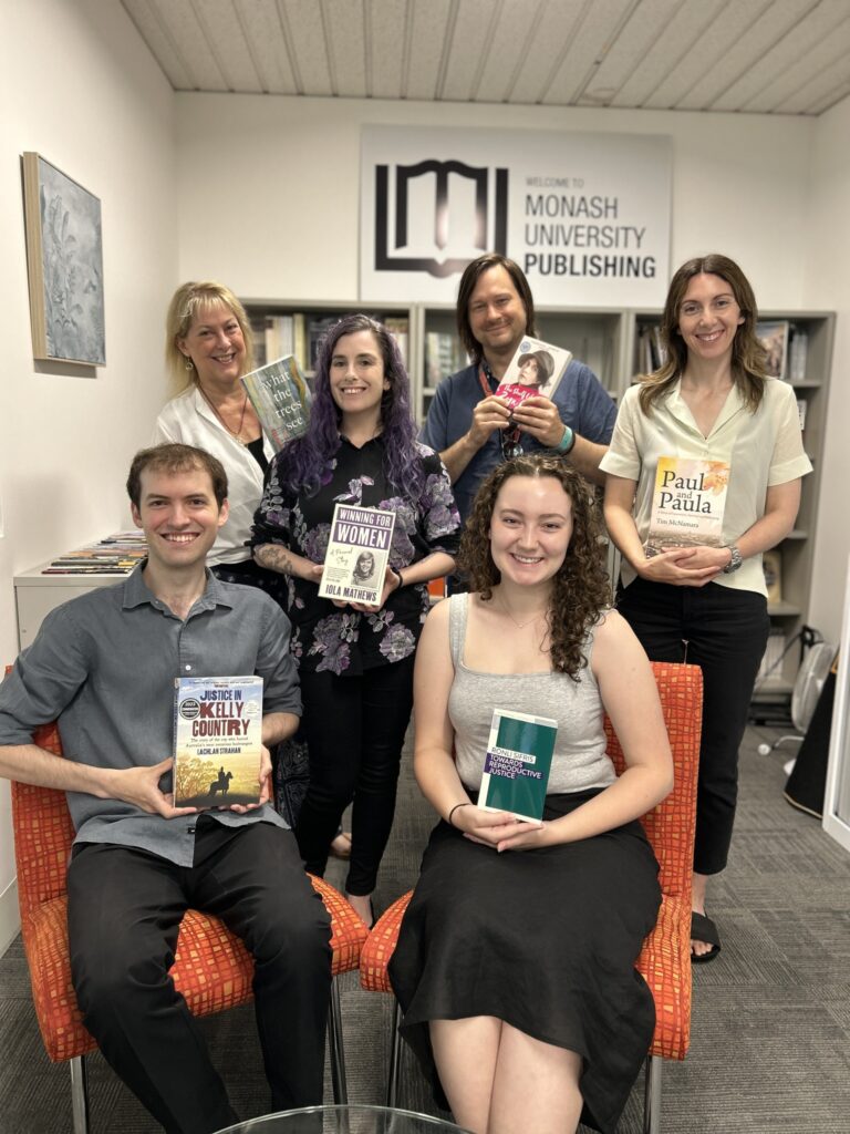 Monash University Publishing team with books