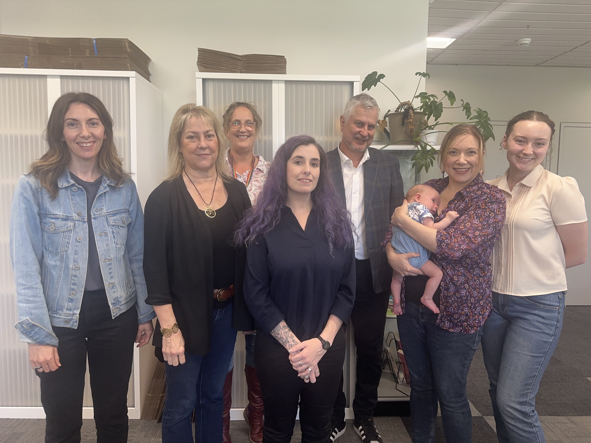 Kate Morgan, Sarah Cannon, Joanne Mullins, Elly Gridland, Malcolm Neil, Julia Carlomagno with newborn baby and Kayla Willson